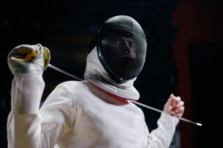 a man in a fencing suit holding a sword, pexels contest winner, 2 0 2 1 cinematic 4 k framegrab, subject made of white mesh rope, wearing a round helmet, badminton