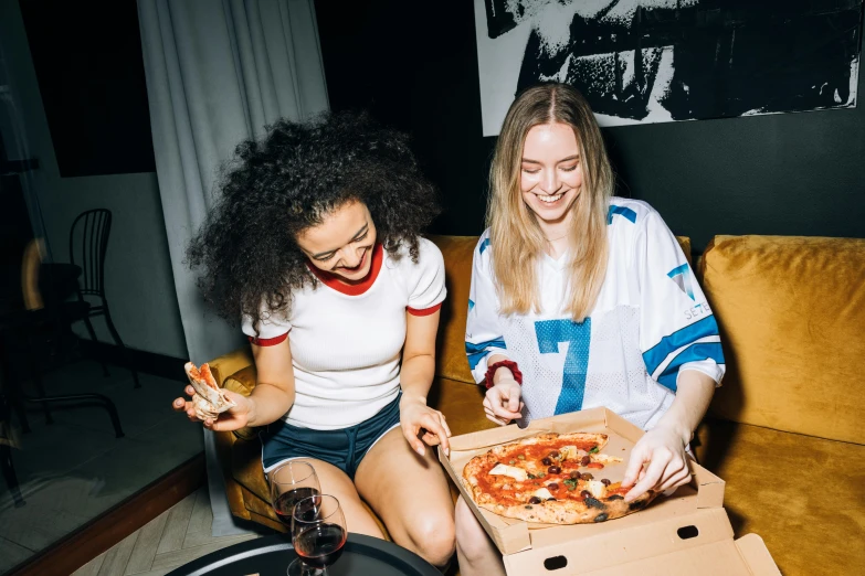 two women sitting on a couch eating pizza, by Julia Pishtar, pexels contest winner, sophie turner girl, superbowl, server in the middle, profile image