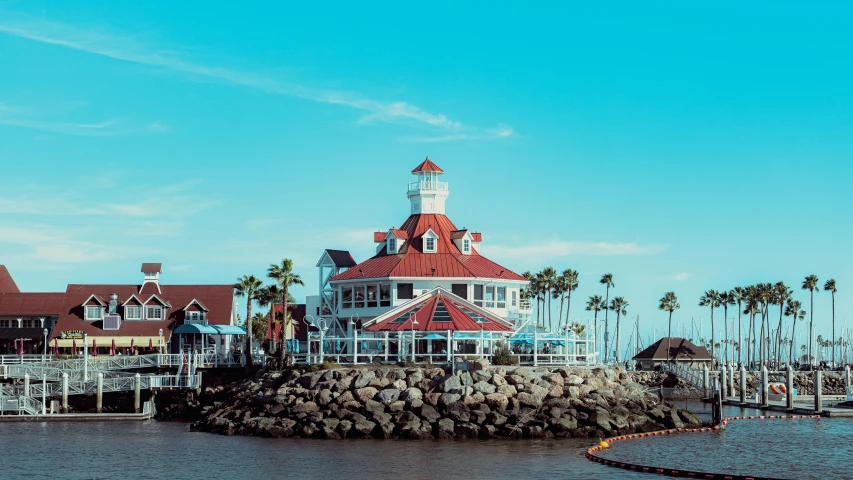 a large building sitting on top of a body of water, by Ryan Pancoast, pexels contest winner, oceanside, restaurant, california, preserved historical