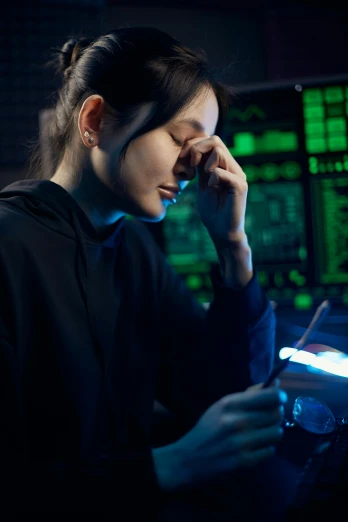 a woman talking on a cell phone in front of a computer screen, dark visor covering eyes, circuitry, looking sad, promo image
