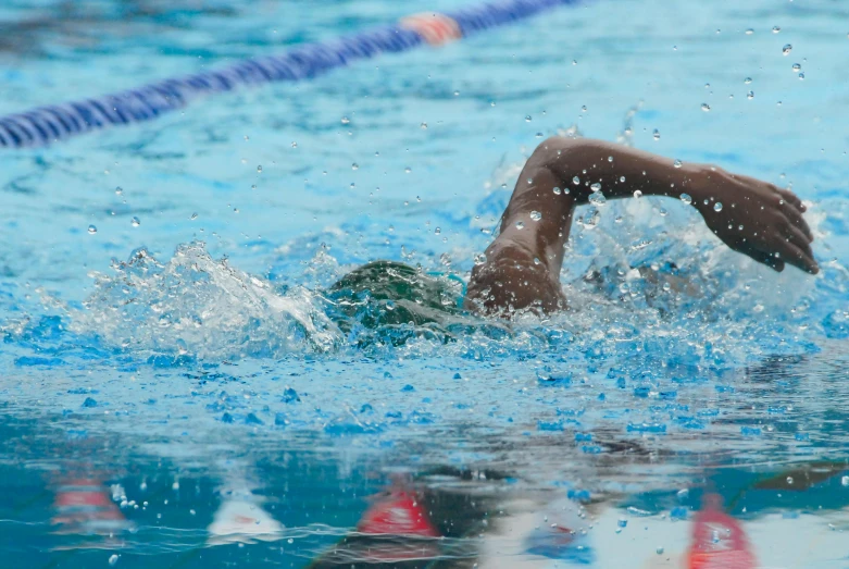 a close up of a person swimming in a pool, profile image, sprinting, thumbnail, 5 feet away