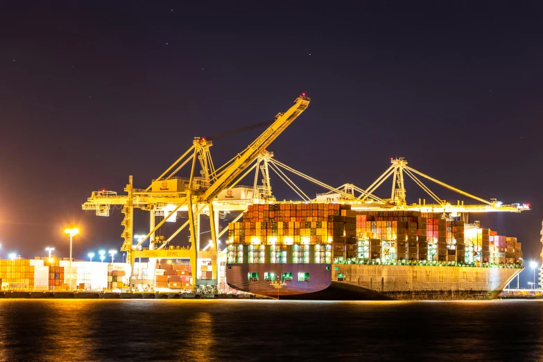 a large container ship sitting on top of a body of water, by Jason Felix, pexels contest winner, night time, avatar image, crane shot, inspect in inventory image