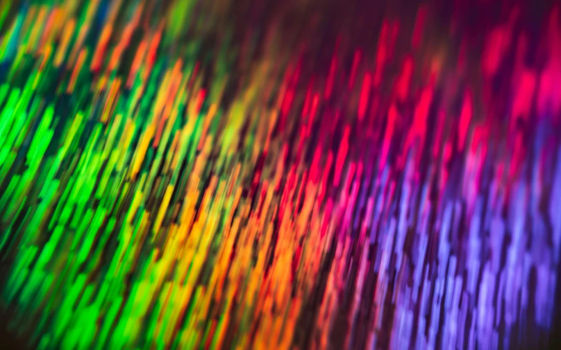 a close up of a rainbow colored background, flickr, holography, bokeh macro lens, daniel richter, fiberoptic hair, vinyl material