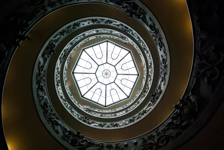 a spiral staircase in a building with a skylight, inspired by Gian Lorenzo Bernini, unsplash contest winner, neoclassicism, promo image, dome, brown, spiralling bushes