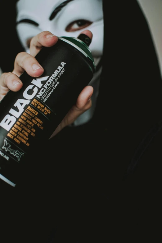 a person wearing a mask and holding a spray can, pexels contest winner, black arts movement, black and auburn colour pallet, product label, drink, black textured