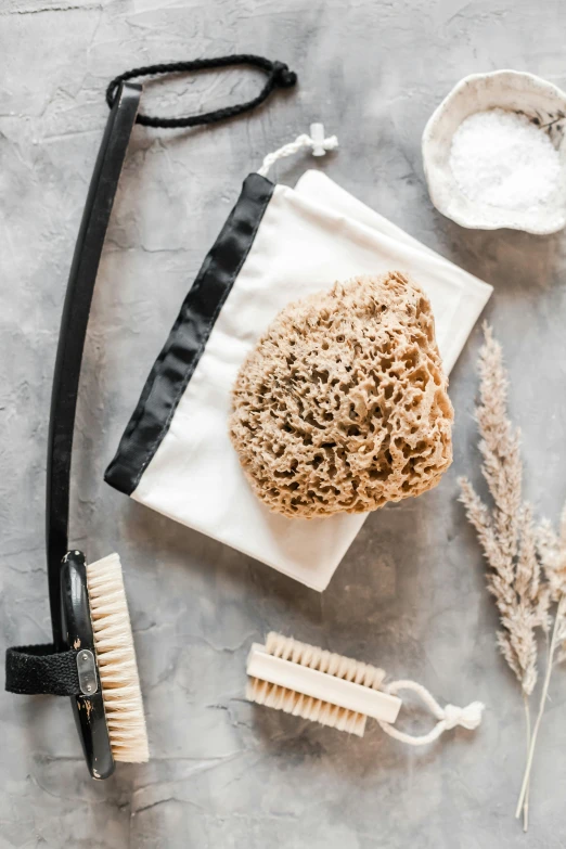 a bunch of items sitting on top of a table, a picture, dry brushing, porous skin, bag, sustainable