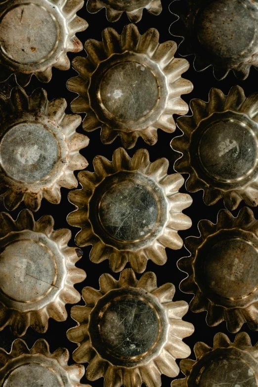 a bunch of vases sitting on top of a table, ((gears)), intricate hyperdetail macrophoto, nepal, brown holes