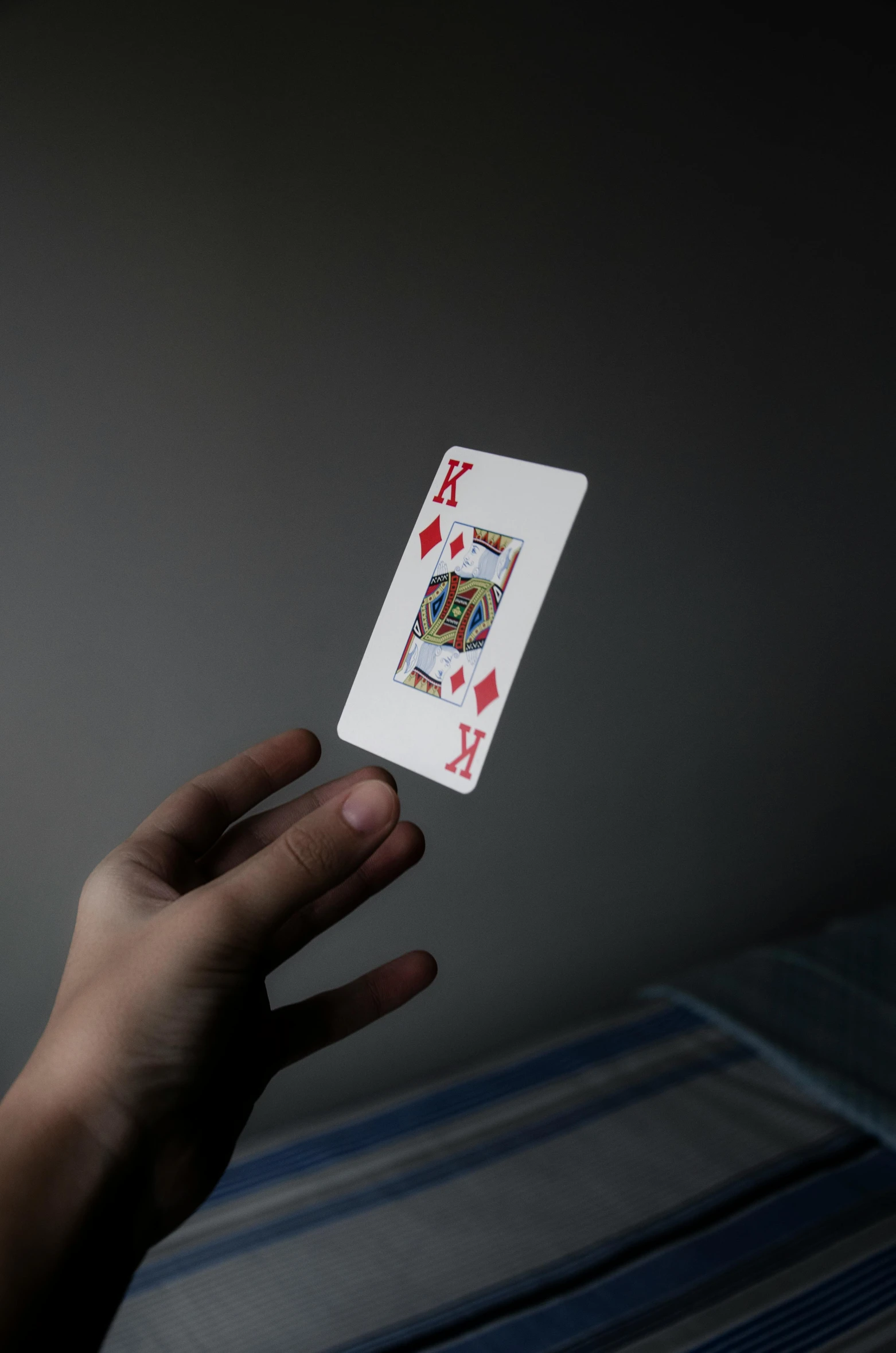 a person holding a playing card in their hand, a hologram, pexels contest winner, square, minimalist photo, large)}], floating in mid - air