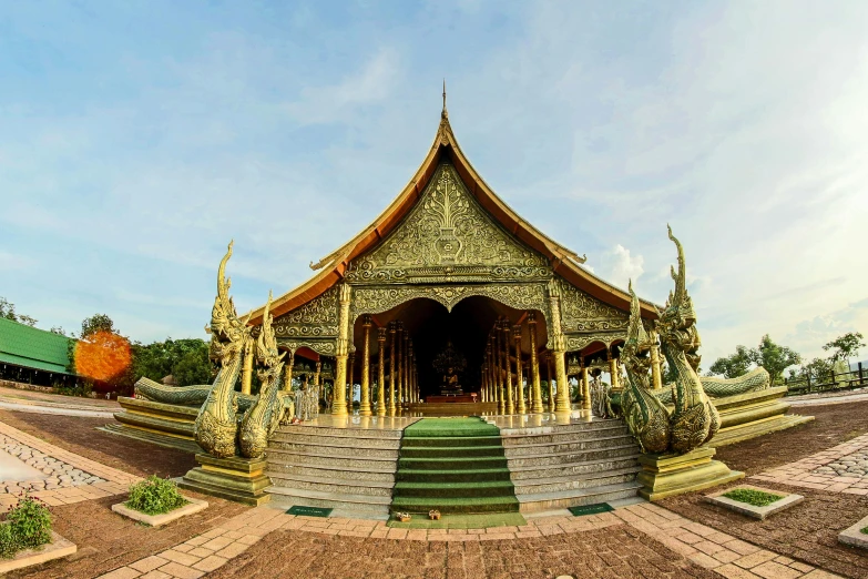 a green and gold building with steps leading up to it, buddhist art, panorama view, square, thawan duchanee