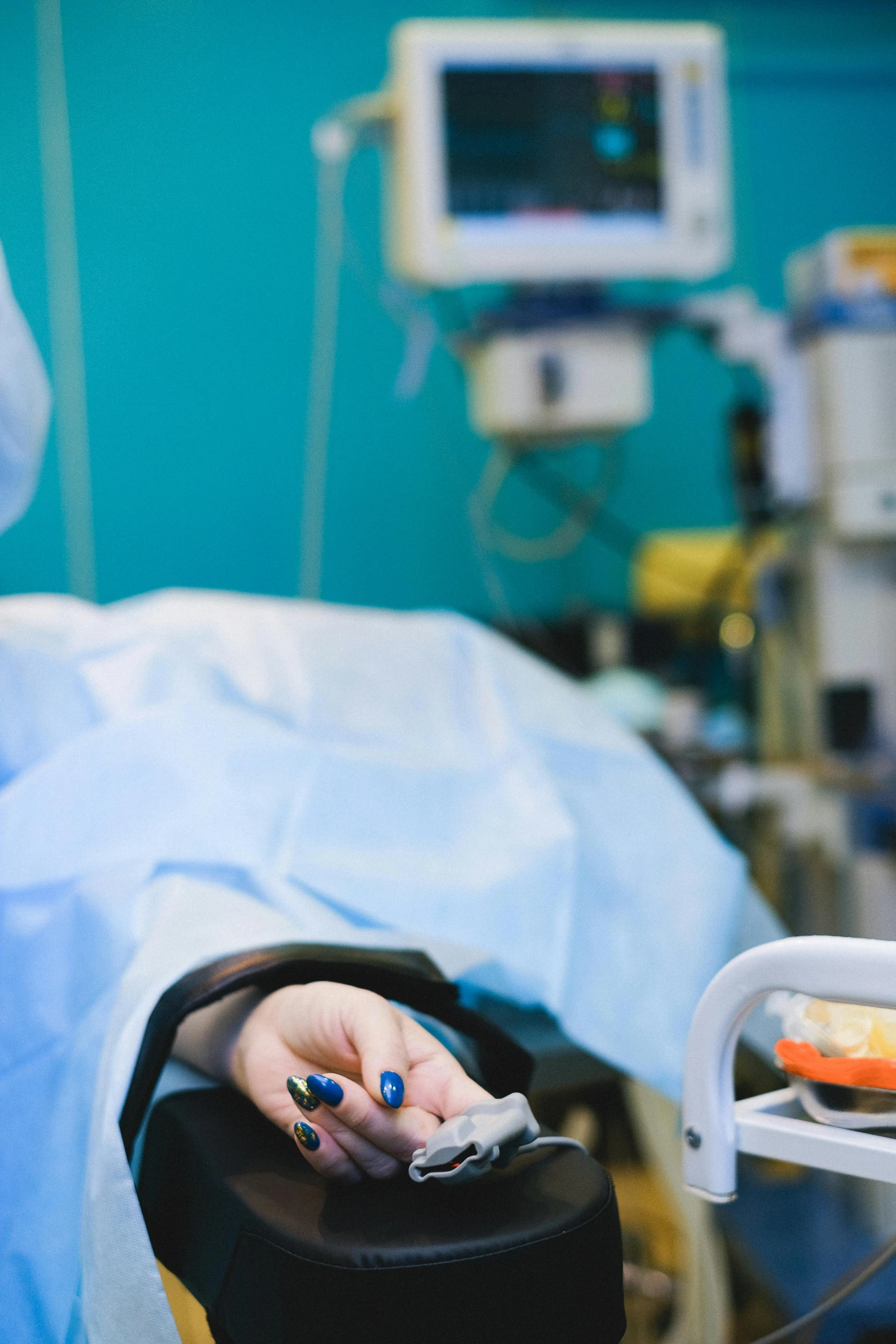 a close up of a person laying in a hospital bed, surgical implements, profile image, petite, environment