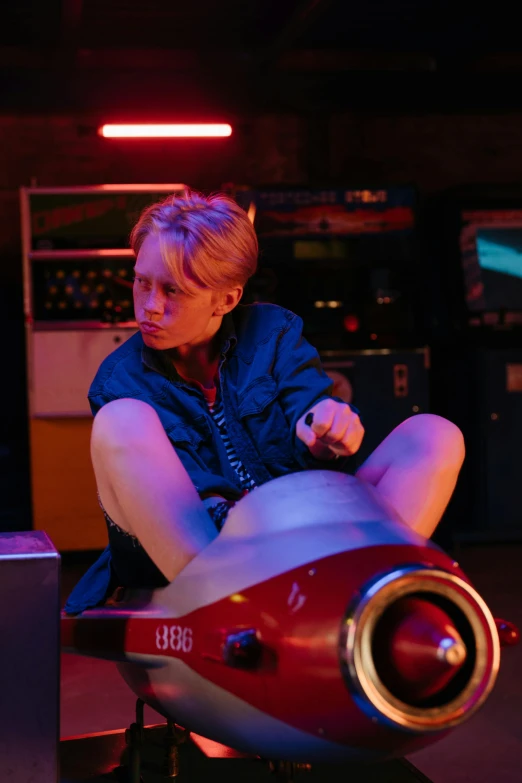 a woman sitting on top of a red motorcycle, inspired by Nan Goldin, featured on reddit, looks like domhnall gleeson, arcade game, nsfw, mechanic