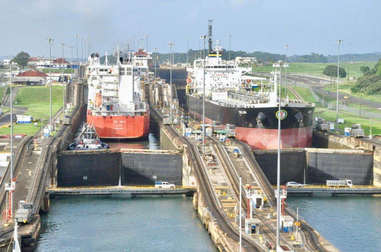a couple of ships that are in the water, pexels contest winner, lock, with walkways, oil lines, múseca illil