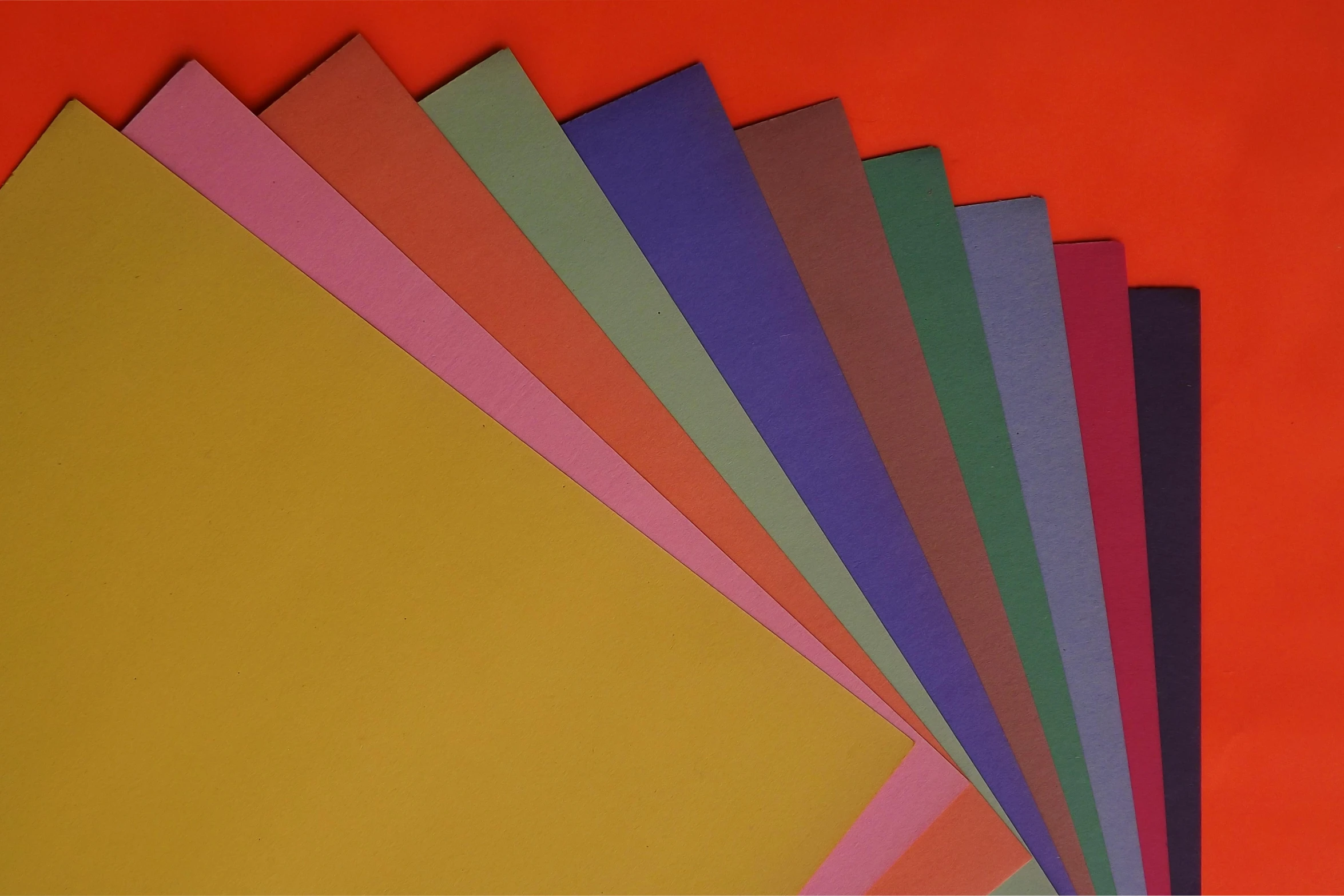 a bunch of colored paper stacked on top of each other, inspired by Stanton Macdonald-Wright, instagram, color field, solid background color, detailed product image, full dynamic colour, schools