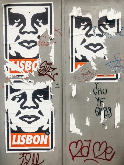 a door with a bunch of stickers on it, poster art, by Ladrönn, reddit, graffiti, portrait of orson welles, lisbon, diptych, 2022 photograph