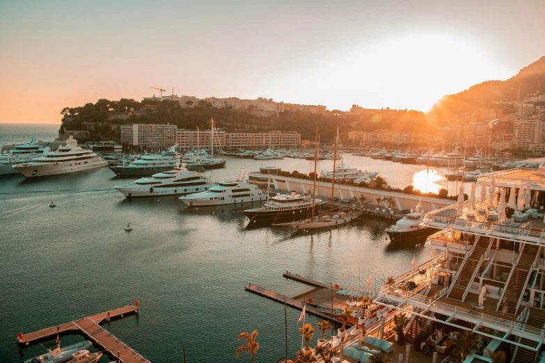 a harbor filled with lots of boats at sunset, pexels contest winner, monaco, fan favorite, sun behind her, thumbnail