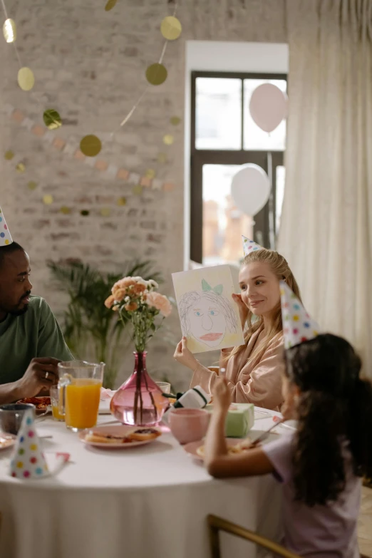 a group of people sitting around a table at a party, birthday card, thumbnail, profile image, cinematic image