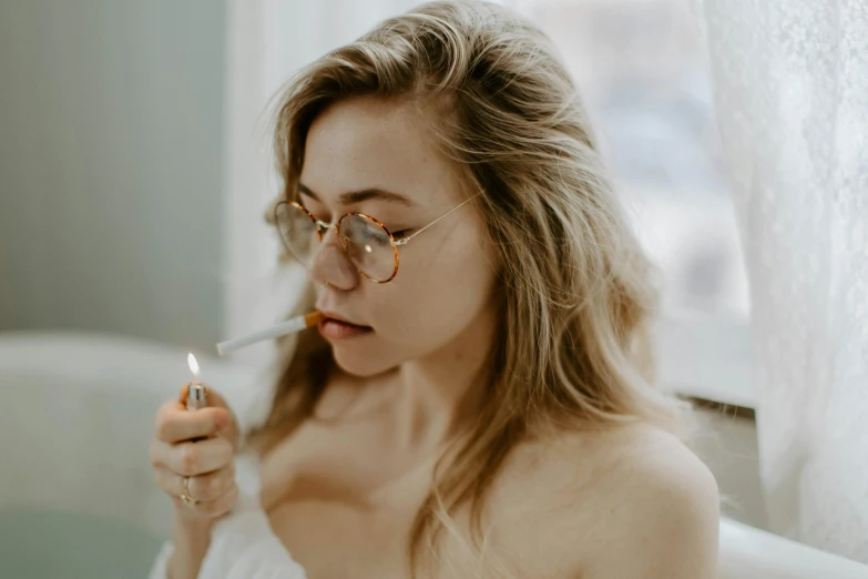 a woman sitting in a bath tub holding a lit candle, inspired by Elsa Bleda, trending on pexels, hyperrealism, wearing gold glasses, woman smoking cigarette, sydney sweeney, on a white table