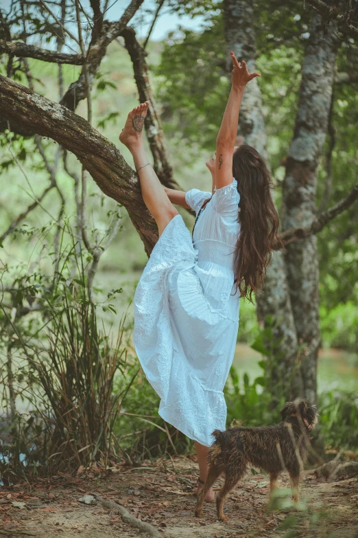 a woman in a white dress hanging from a tree, pexels contest winner, brunette fairy woman stretching, instagram post, ( ( ( kauai ) ) ), cottage hippie naturalist