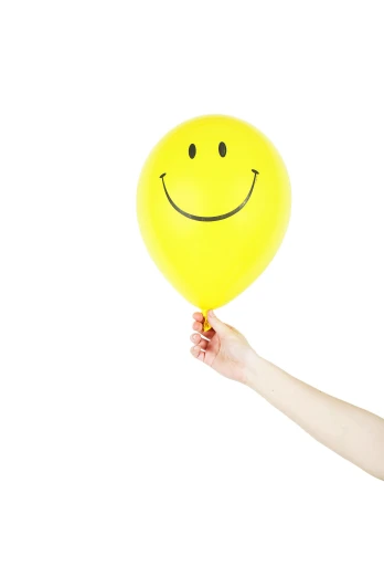 a woman holding a yellow balloon with a smiley face drawn on it, by Matthias Stom, pexels, set against a white background, close-up photograph, 15081959 21121991 01012000 4k