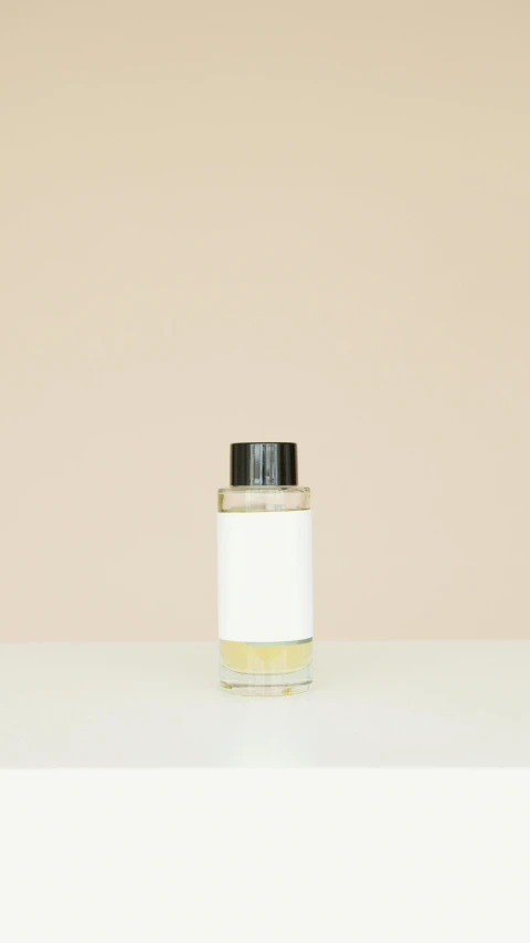 a bottle of perfume sitting on top of a table, by Harvey Quaytman, minimalism, clean face and body skin, thumbnail, birch, null