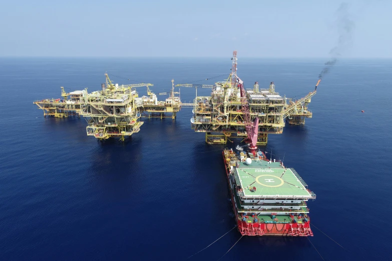 an oil rig in the middle of the ocean, dau-al-set, massive structures, thumbnail, full room view, drone photograph