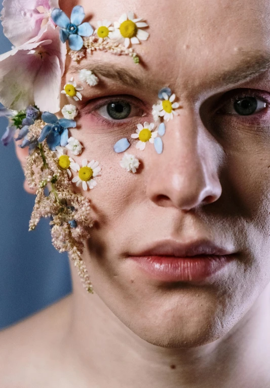 a close up of a person with flowers on their face, an album cover, trending on pexels, caspar david, elven male, nonbinary model, beskinski