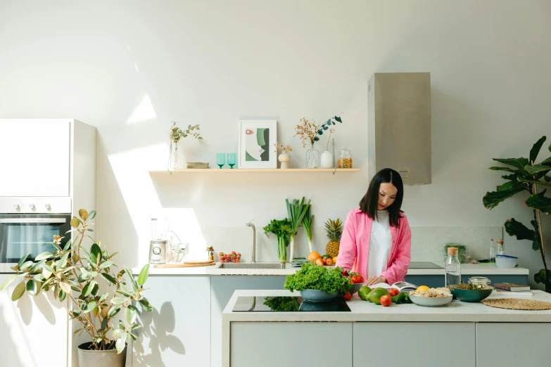 a woman standing in a kitchen preparing food, inspired by Li Di, pexels contest winner, clean minimalist design, garden at home, profile image, james jean and fenghua zhong