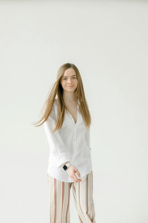 a woman in a white shirt and striped pants, a character portrait, trending on unsplash, long flowy hair, white background : 3, yulia nevskaya, wearing a linen shirt