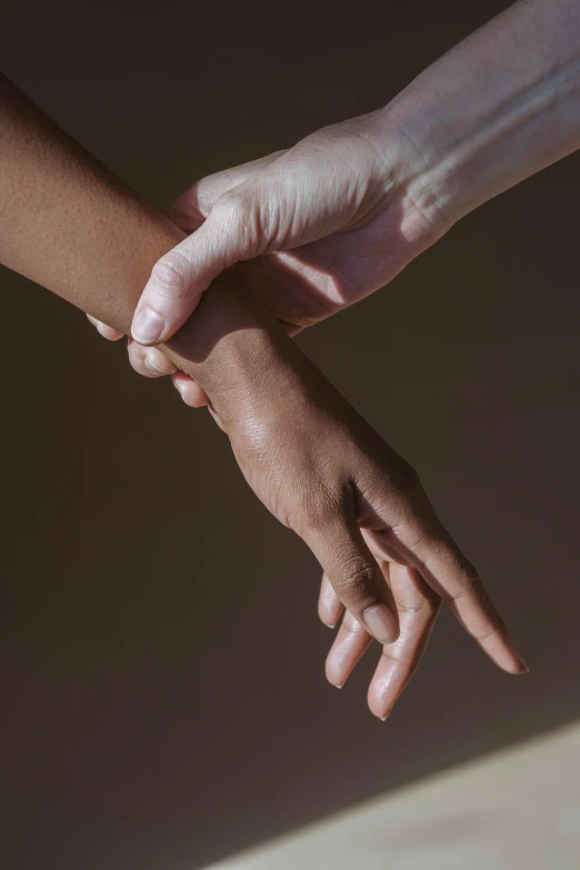 a close up of two hands touching each other, by Nina Hamnett, varying ethnicities, bandage on arms, uplit, childish