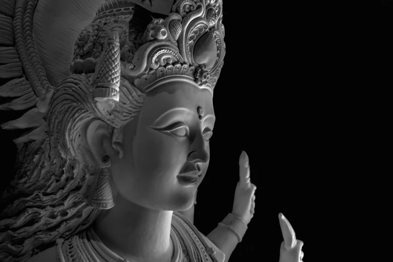 a black and white photo of a statue, a statue, by Saurabh Jethani, featured on zbrush central, indian goddess of wealth, highly detailed face and hand, she is approaching heaven, maya 8 k