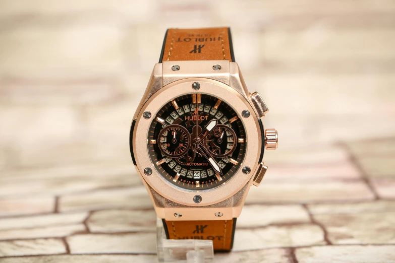 a close up of a watch on a table, hurufiyya, hublot, full face view, 2263539546], brown ) )