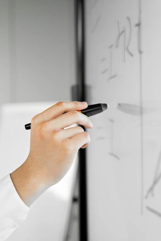 a woman writing on a white board with a marker, pexels, analytical art, black on white, scientific research, finger, no - text no - logo