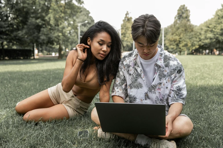 a man and woman sitting in the grass with a laptop, pexels, renaissance, wearing a camisole and shorts, asian descent, joel fletcher, wearing a crop top