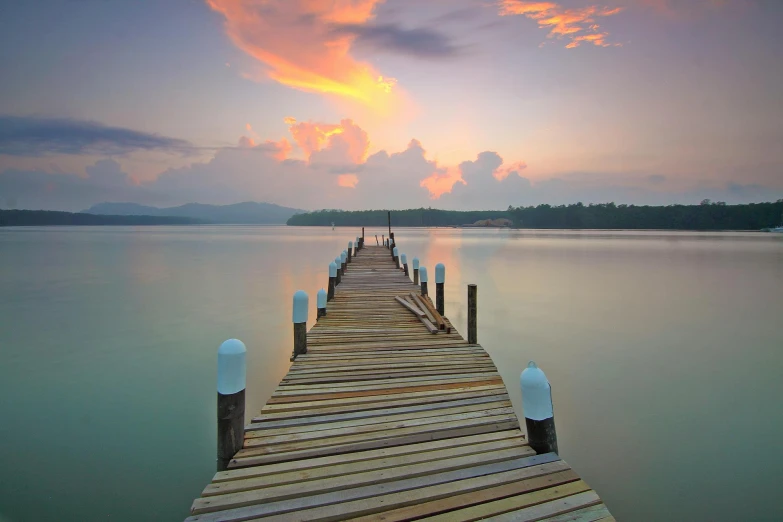 a dock in the middle of a body of water, pexels contest winner, pastel sunset, vray beautiful, just after rain, walkway