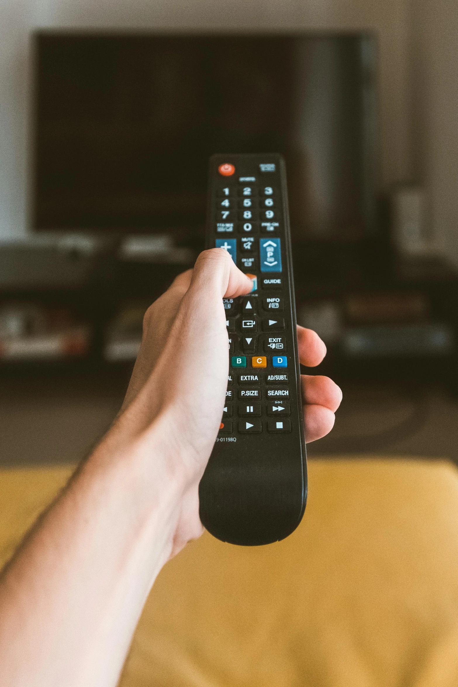 a person holding a remote control in their hand, pexels, square, toggles, belgium, performing