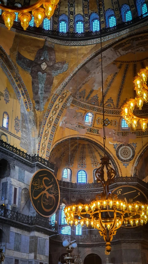 a couple of chandeliers hanging from the ceiling of a building, a mosaic, trending on unsplash, with great domes and arches, byzantine painting, 256x256, turkey