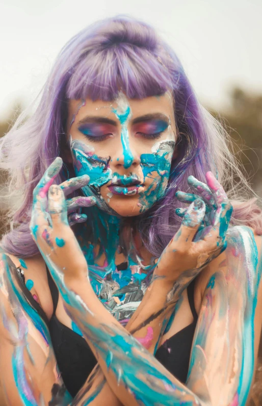 a woman with blue and purple paint on her face, trending on pexels, process art, anime character; full body art, mess, painted nails, freaky