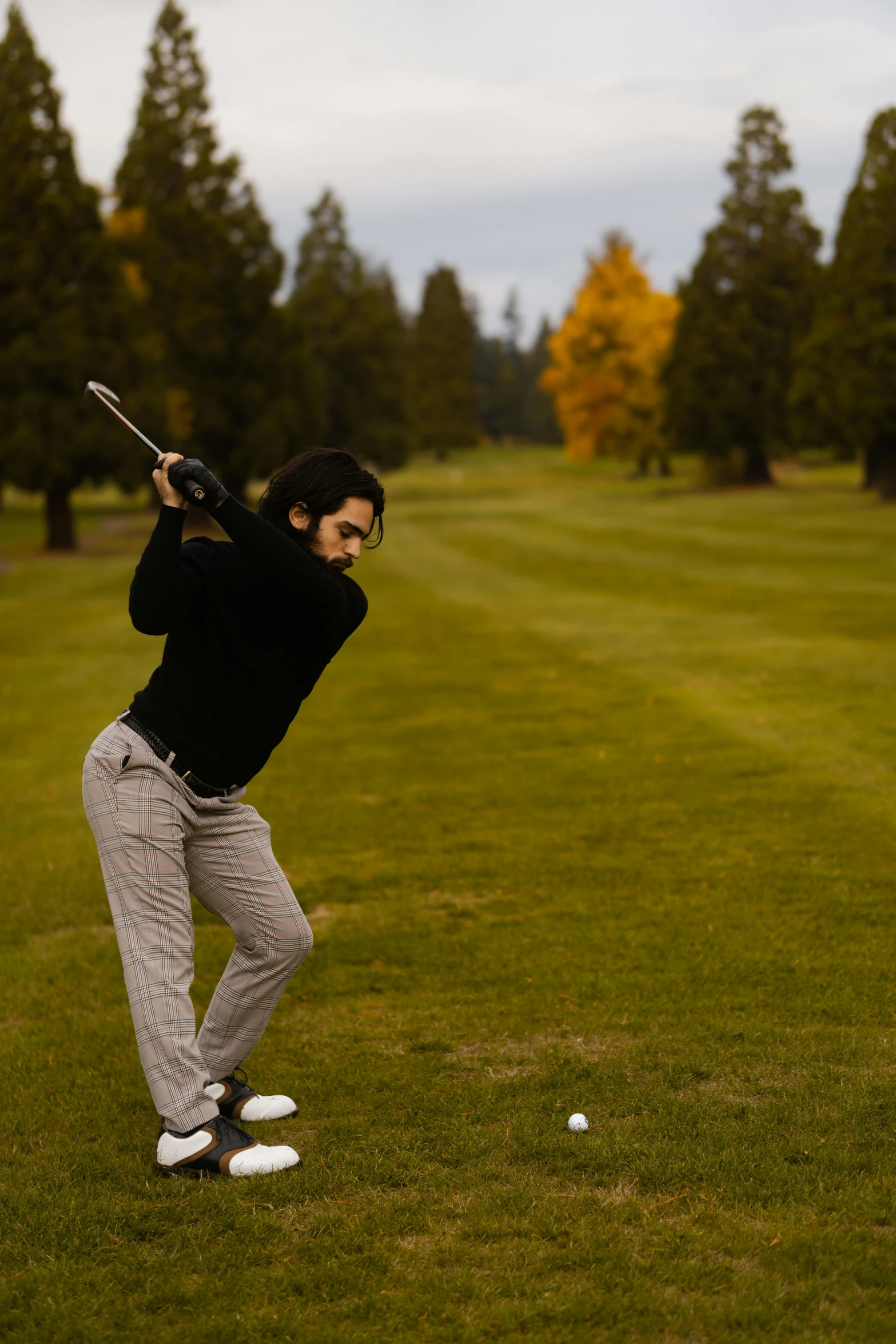 a man swinging a golf club at a golf course, by David Simpson, unsplash, renaissance, seattle, mid fall, thumbnail, 1 2 9 7