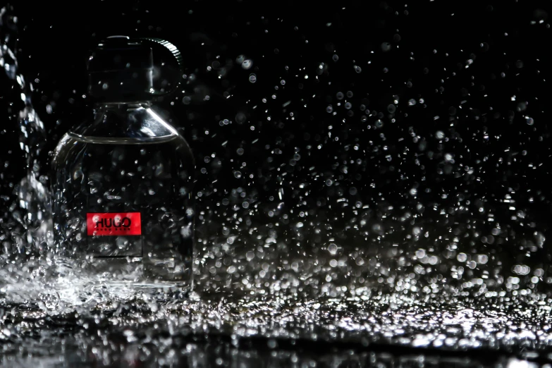 a close up of a bottle of water on a table, unsplash, hyperrealism, raining at night, serge lutens, light blood spatter, falling snow