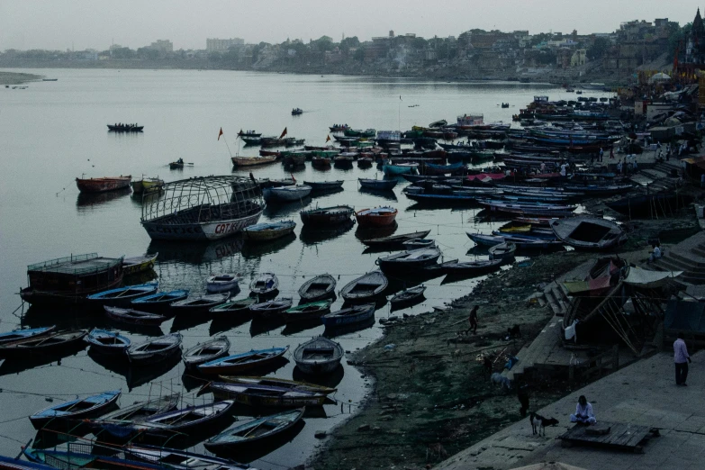 a large body of water filled with lots of boats, by Sunil Das, pexels contest winner, fan favorite, grey, on location, deep colour