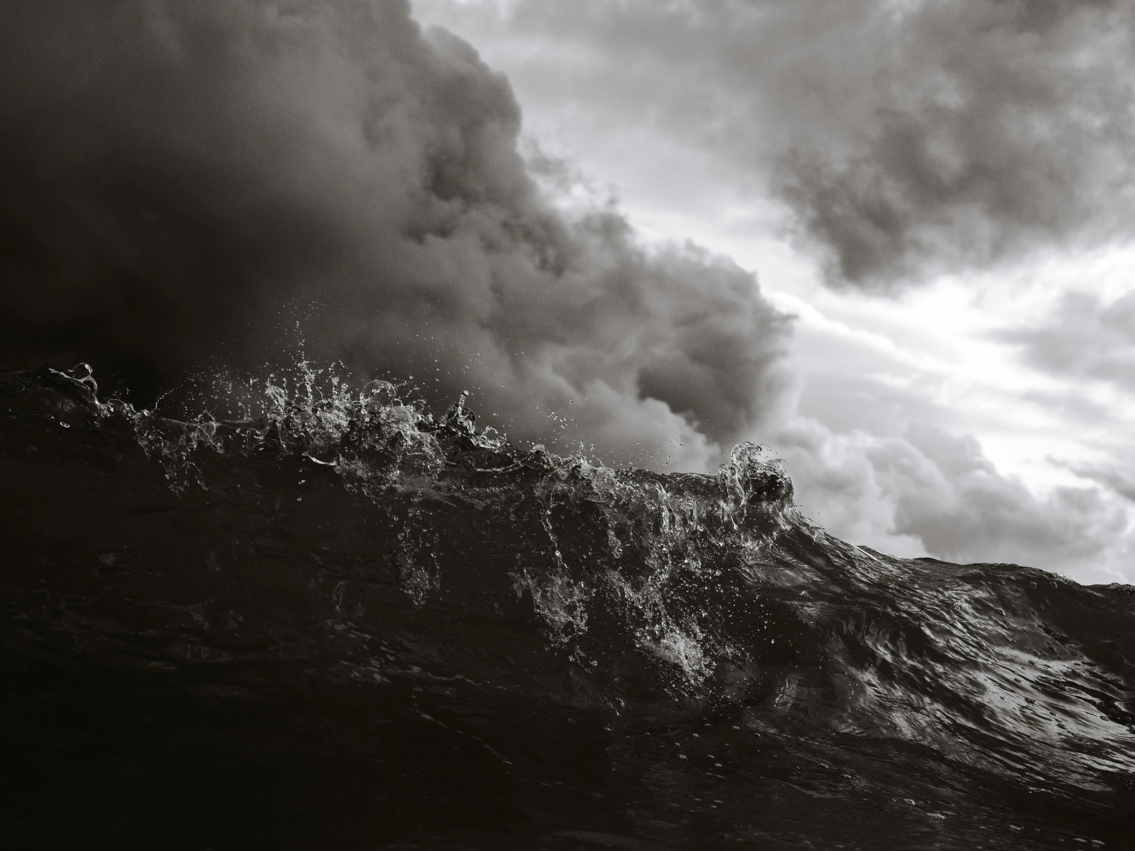 a man riding a wave on top of a surfboard, a black and white photo, pexels contest winner, surrealism, chaotic storm of liquid smoke, photo of a camp fire underwater, ominous clouds, a ship lost in a storm