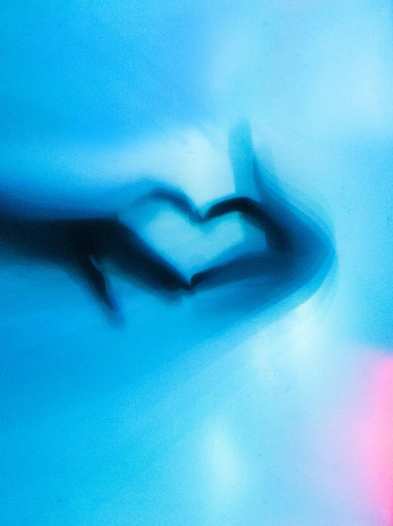 a blurry photo of two hands in the shape of a heart, an album cover, inspired by Tracey Emin, trending on unsplash, romanticism, neon blue, soft airbrushed artwork, profile image, abstract figurative art