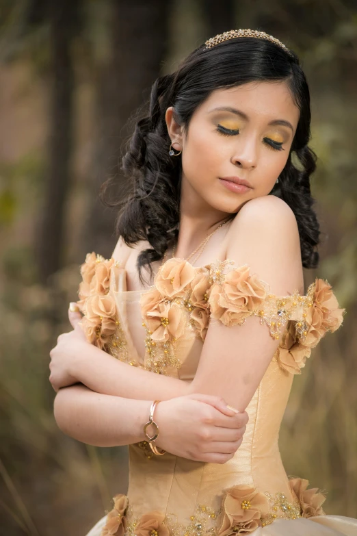 a woman in a yellow dress posing for a picture, an album cover, inspired by reyna rochin, pexels contest winner, baroque, dslr photo of a pretty teen girl, beige and gold tones, outdoor fine photography, beautifully soft lit