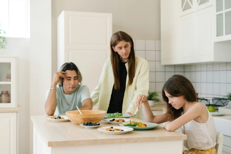 a woman and two children sitting at a kitchen counter, trending on pexels, hyperrealism, anorexic figure, dinner is served, annoyed, on a white table