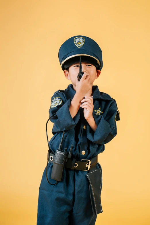 a little boy dressed up as a police officer, an album cover, unsplash, japanese, roleplaying, high quality product image”, profile pic