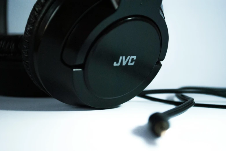 a pair of headphones sitting on top of a table, a picture, by John Covert, jsc, camera angle from below, **cinematic, close - up profile
