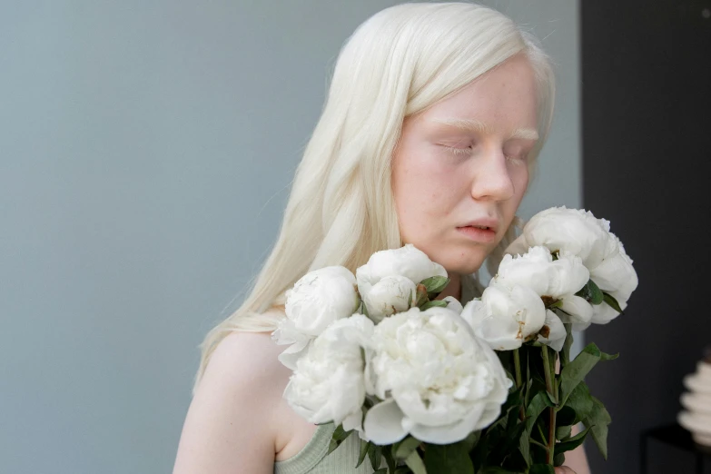 a woman holding a bunch of white flowers, inspired by Vanessa Beecroft, tumblr, albino skin, closes her eye, silicone skin, with white long hair