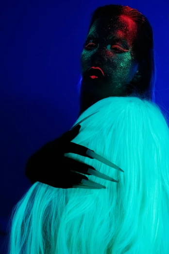 a close up of a person with long white hair, an album cover, inspired by Elsa Bleda, grace jones fashion, colored gel lighting, glowing guy creature, dramatic lighting - n 9