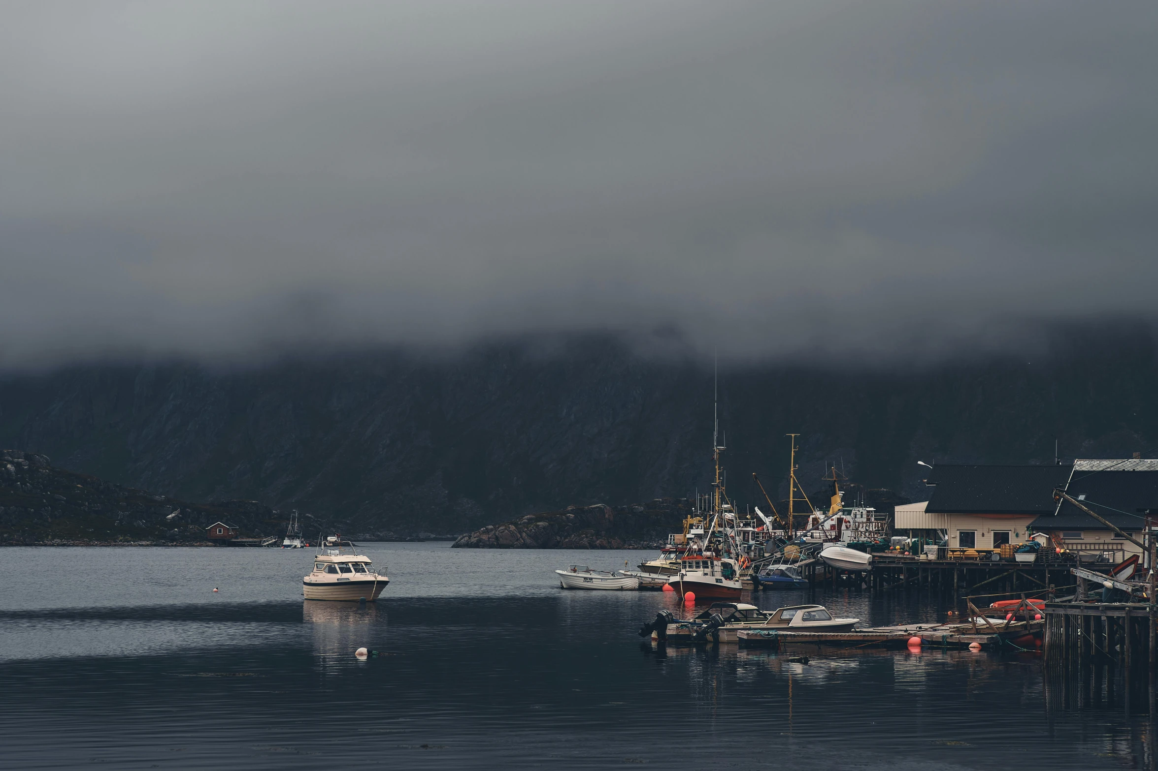 a number of boats in a body of water, by Sebastian Spreng, pexels contest winner, hurufiyya, dark grey, fjords, thumbnail, a cozy