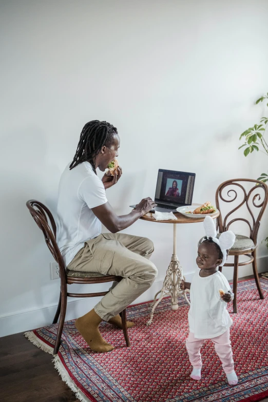 a man sitting at a table with a small child, unsplash, young thug, everything fits on the screen, full body photograph, long distance photo